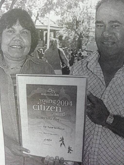 AUSTRALIA DAY HONOURS 2004: Proud parents Lorraine and Harold accept Todd Williams' Young Citizen of the Year award.