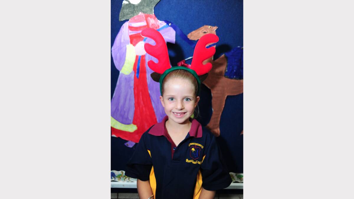 ALL I WANT FOR CHRISTMAS: St Mary's Primary School kindergarten student Maggie Wills would like a Furby, Sylvanian Families and more barbies. 