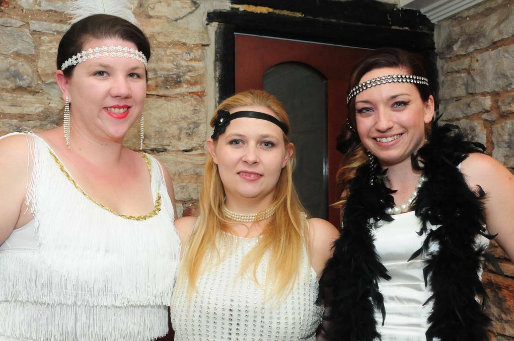 Jess Salmon, Kristy Cooper and Sarah Malone from the Dubbo Young Professionals Network galmmed up with accessories from the 1920s.