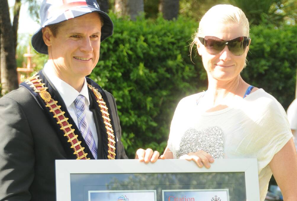 Jane Fardell receives her Australia Day award from mayor Mathew Dickerson. Photo: KATHRYN O'SULLIVAN
