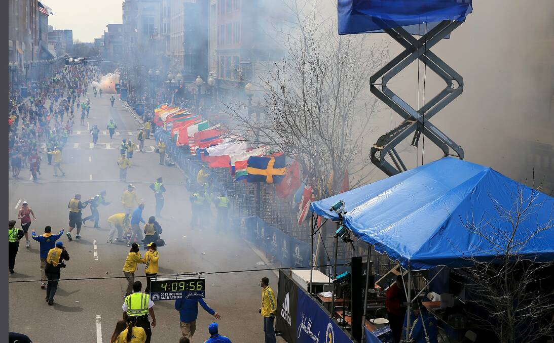 Two explosions go off near the finish line of the 117th Boston Marathon. Photo: DAVID RYAN
