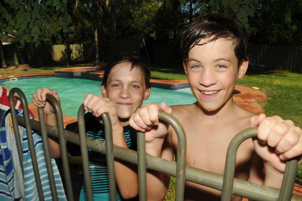 Jonas and Finn Palin were enjoying the cool pool water yesterday. photo: AMY MCINTYRE