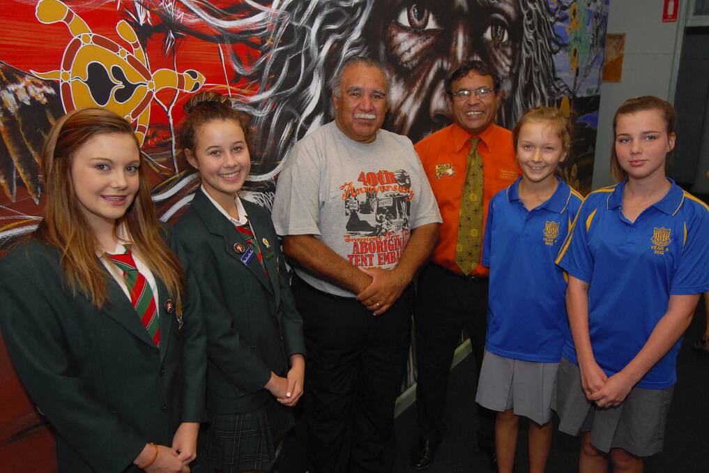 Dubbo College South Campus students Leticia Quince and Jessica Skinner with original Aboriginal Tent Embassy member Michael Anderson, teacher and learning co-ordinator of Aboriginal education Allan Hall with Dubbo South Public School students Alexandra Lindsay and Monica Peterson. Photo: BELINDA SOOLE