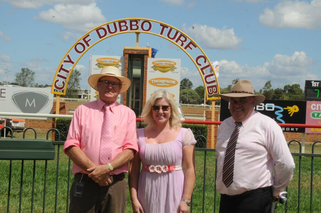 Dubbo Turf Club chairman Robert Elllis proudly dressed in pink with McGrath Foundation board member Tracy Bevan and Turf Club general manager Mark Day raising money for cancer research yesterday. 	Photo: KATHRYN O’SULLIVAN