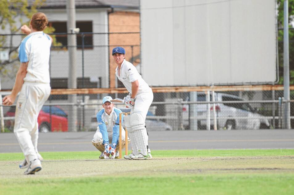 Andrew Page is a picture of concentration during his mammoth innings for Macquarie against Rugby at No.1 Oval on Saturday.     Photos: JOSH HEARD