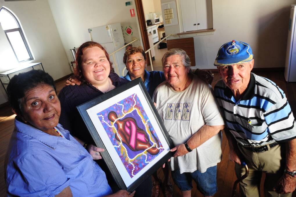 Brooke Sullivan, (second from left) shows her painting called Spiritual Support to Robin Payne, Trixie Watts, Regina Carpenter and Peter Carpenter at the Dubbo Aboriginal Cancer Support Group meeting. Photo: LOUISE DONGES