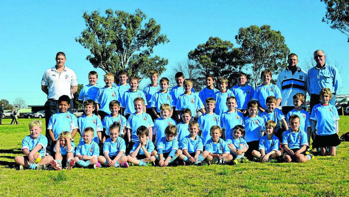 Canowindra Junior Pythons under 7s coach Matt Rice (left), Scott Hickman (under 11s) and Tony Grant (under 9s) with the three teams on Sunday at the Walla Rugby Gala Day.