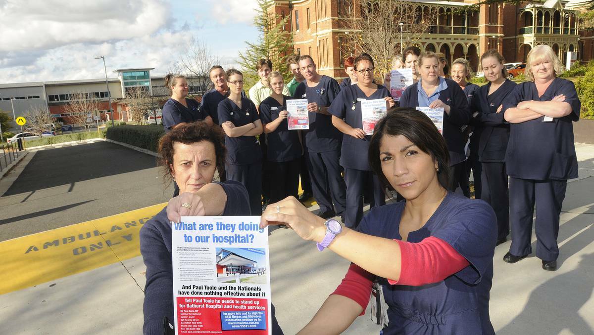 BATHURST: NSW Nurses and Midwives Association Bathurst branch members Lyn Sloane and Tatiana Muller (front) and their nursing colleagues are fighting planned cuts at Bathurst Base Hospital. Photo: CHRIS SEABROOK 052813cnurses