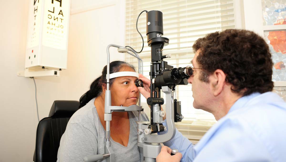 DUBBO: Dr Paul Adler checking the eyes of Tania Button at the new public eye clinic on Bourke Street. Photo: Belinda Soole