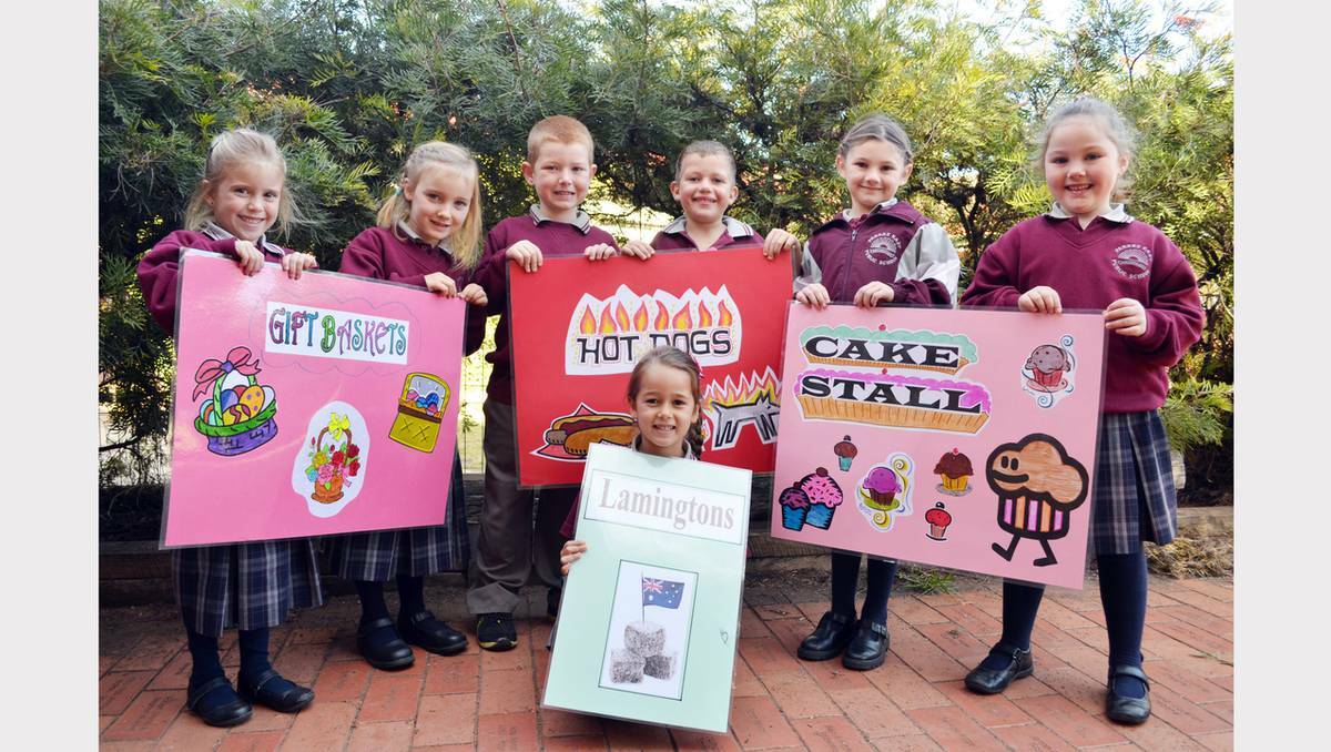 Students from Parkes East School preparing for the fete on Saturday June 1. Mia Cummings, Matilda Hargrave, Jeremiah Alexander, Lachlan Plummer, Montanah Phipps and Isabella Hughes; and kneeling, Keira Bloomfield are ready for the Parkes East Fete