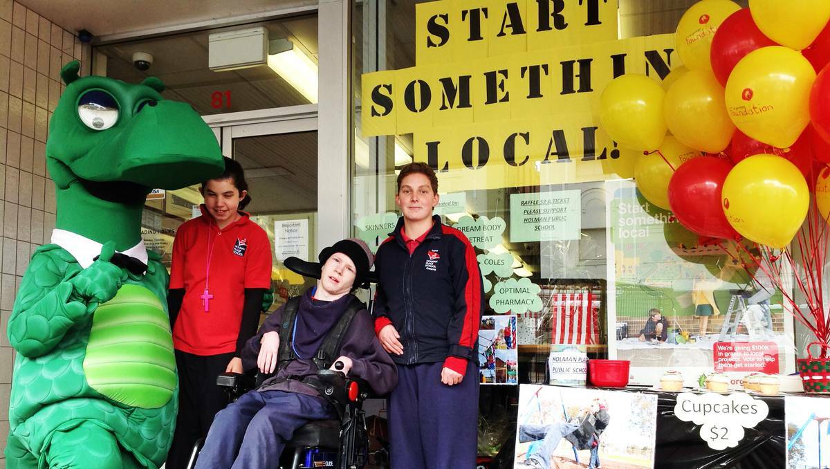 COWRA: Happy the Dragon teamed up with Holman Place School students Jakayla Cutmore, Blake Howden and Tara Dennis last week, selling cupcakes to raise community awareness for their entry in St George's 'Start Something Local' program.