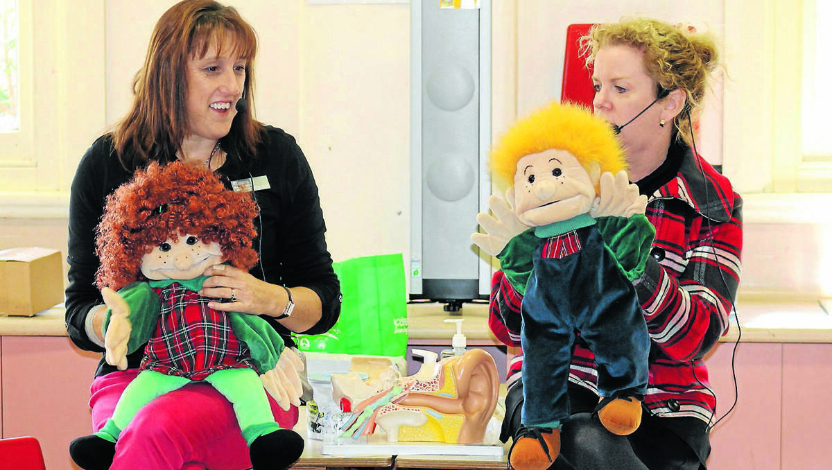 MUDGEE: Hearing support teachers Rachel Mills and Donna Rees, assisted by Lucy and Sam, teach Infants students at Mudgee Public School the ways to avoid hearing loss brought on by Otitis Media.