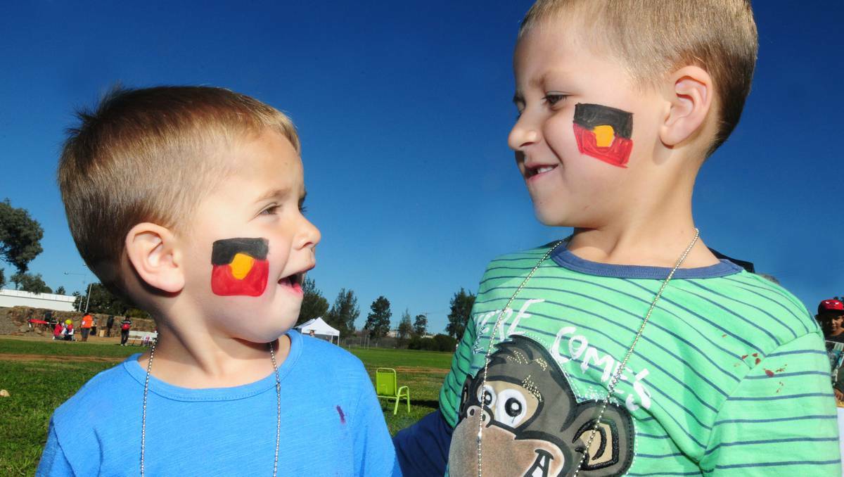 Cousins Kyrell Peckham and Kyran Earsman enjoyed the face painting activity at Dubbo's Wiradjuri Park when UnitingCare Burnside hosted a NAIDOC Week event last Friday. Photos: LOUISE DONGES