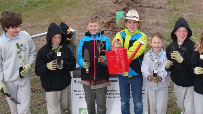 COWRA: Students learn tree planting techniques and how to grow and identify native shrubs and trees as part of their Stephanie Alexander Kitchen Garden curriculum.
