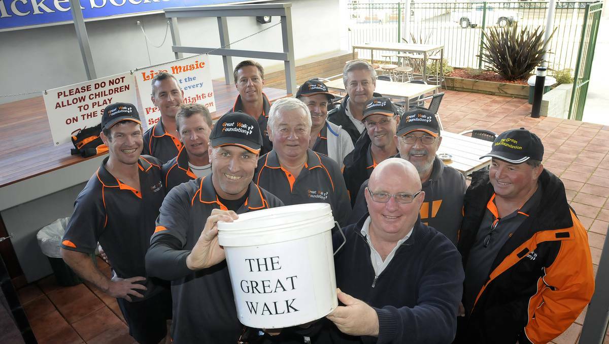 BATHURST: Leader of The Great Walk team Jonathan Green, front left, and Scotty Macallister from the Knickerbocker Hotel in Bathurst ready to raise more funds for charity. Photo: CHRIS SEABROOK 052713cgtwalk