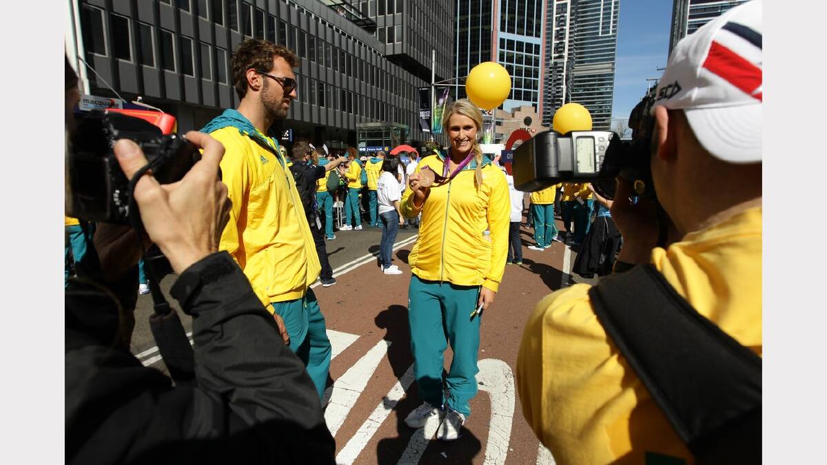 Crowds line George St and in front of the Town Hall for the official welcome home of the 2012 Australian Olympic Team  
