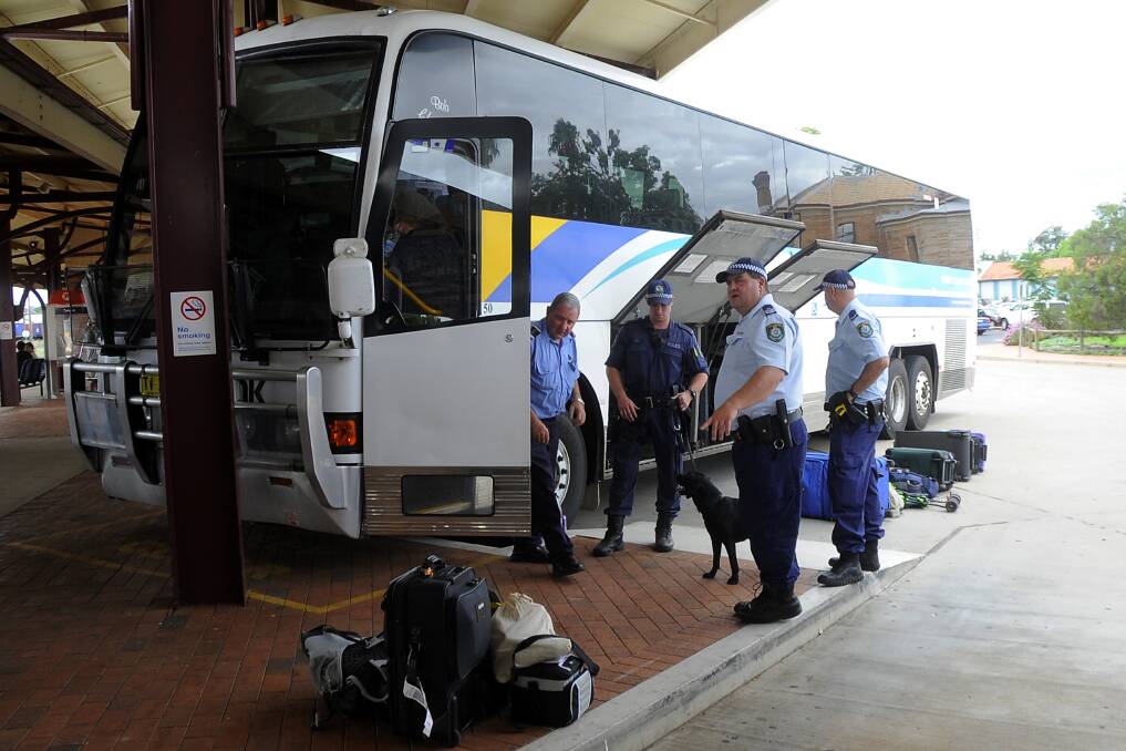 Police dog and officers search passengers and luggage at Dubbo Railway Station. Photo: Belinda Soole (Flick across to see more images).