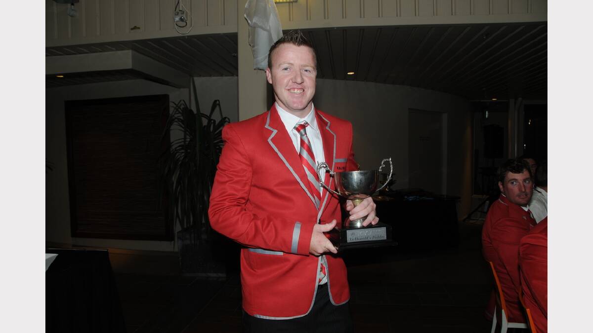Chris Morton with the McDonald's Megahit trophy won by Black Dog Institute.