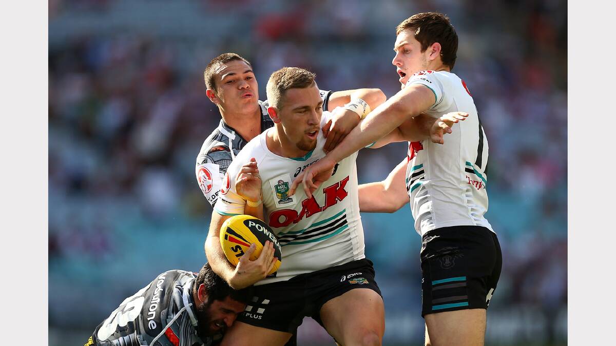 Isaah Yeo (right) in support for teammate Bryce Cartwright in Penrith’s Holden Cup grand final win yesterday at ANZ Stadium. 					      Photo: GETTY IMAGES