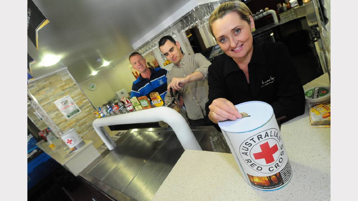 Collection tins are on the bars at the Amaroo Hotel to raise money for the Australian Red Cross and assist bushfire victims across the state.