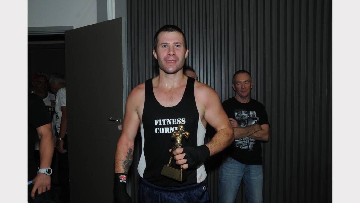Fitness Corner's Adam Darlington was declared the winner by split decision after he clashed with Cowra's Liam Slater.       Photo: CHERYL BURKE