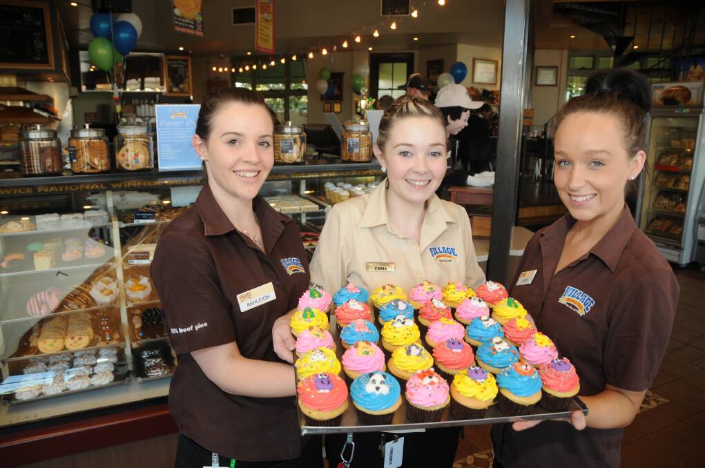 Ashleigh Wyatt, Emma Stevenson and Lauren Fell with some of the treats made of the RSPCA Cupcake Day.  Photo: AMY MCINTYRE