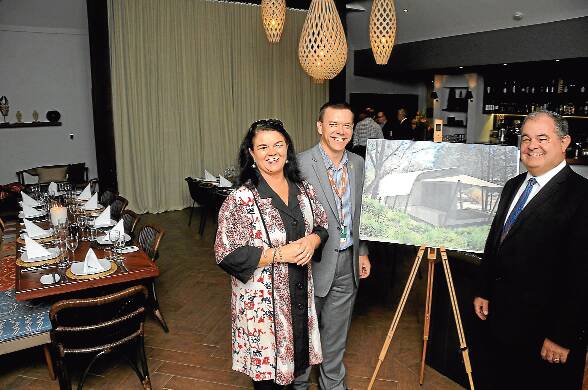 Members of the Taronga Conservation Society Australia Board Jen Cowley and John Walkom (right) discuss the redevelopment of Taronga Western Plains Zoo’s Zoofari Lodge with zoo general manager Matt Fuller at the dinner unveiling the new-look main guest house.	 Photo: BELINDA SOOLE