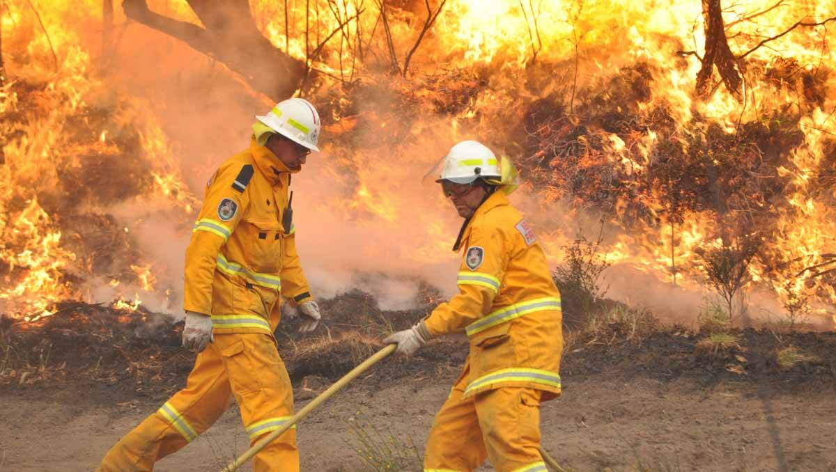 Rural Fire Service volunteers in action near Lithgow yesterday. 	Photo: CAROLYN PIGGOTT
