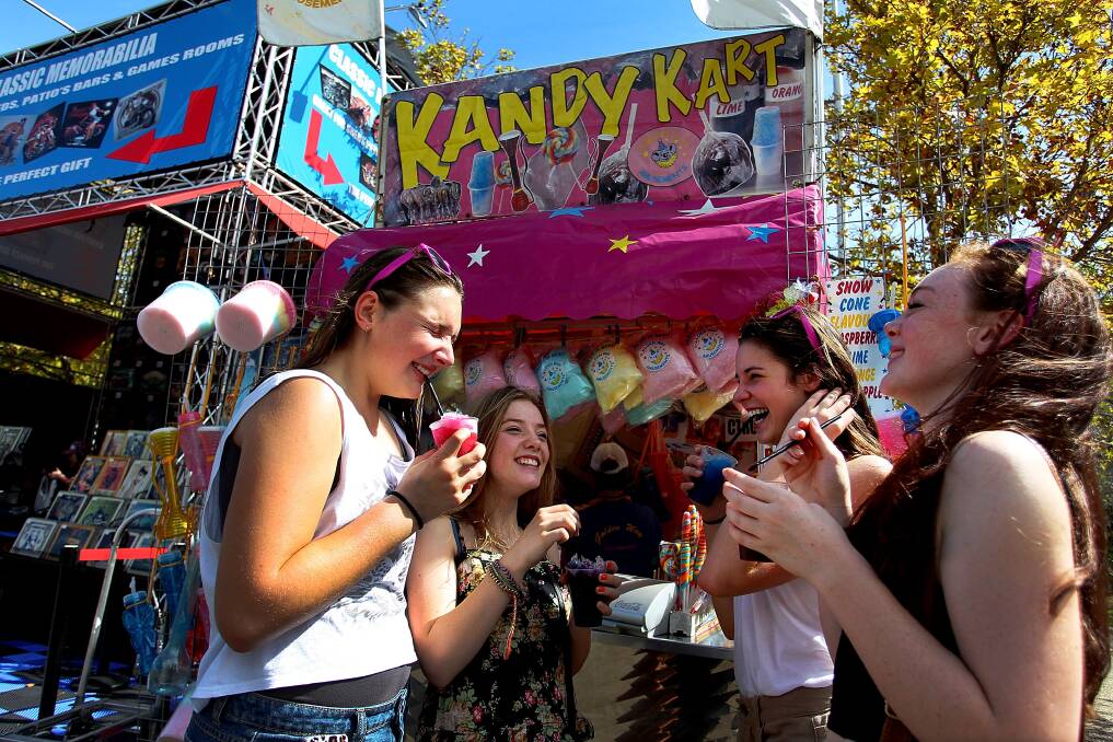 Young girls enjoy ice drinks during the Sydney Royal Easter Show in Sydney, Australia. Photo by Lisa Maree Williams/Getty Images