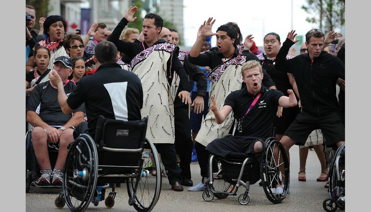 Tim Prendergast (R) and Cameron Leslie (Front 2nd R) of New Zealand Perform the Haka during the New Zealand Flag Raising Ceremony at the Olympic Park on August 27, 2012 in London, England. (Photo by Christopher Lee/Getty Images)