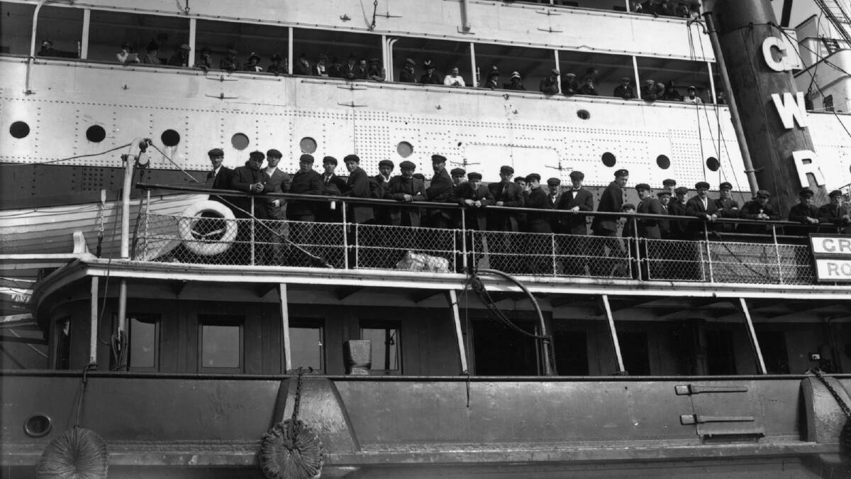 Survivors of the 'Titanic' disaster on board a tug, arriving at Plymouth. Photo by Topical Press Agency/Getty Images