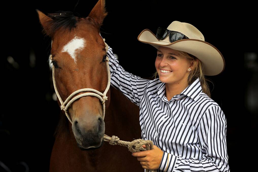 Maddy Coleman poses with show horse 'Chopper' at the Sydney Royal Easter Show in Sydney, Australia. Photo by Lisa Maree Williams/Getty Images