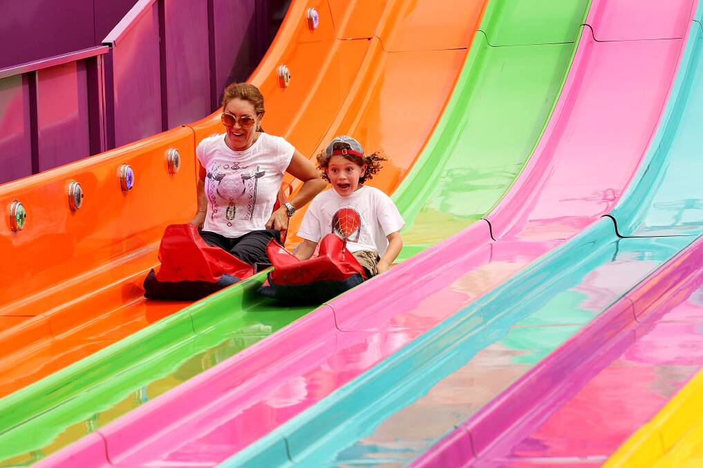 Sydneysiders take on the 'Super Slide' at the Sydney Royal Easter Show in Sydney, Australia. Photo by Lisa Maree Williams/Getty Images