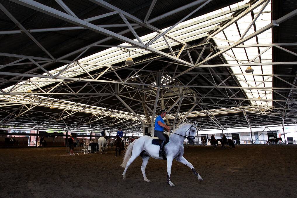Horse riders prepare to show at the Schmidt Arena during the Sydney Royal Easter Show in Sydney, Australia. Photo by Lisa Maree Williams/Getty Images