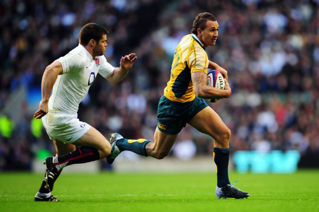 Quade Cooper is tackled during the Rugby Championship match between the Australian Wallabies and Argentina at Skilled Park on September 15, 2012 on the Gold Coast, Australia. Photo by Chris Hyde/Getty Images