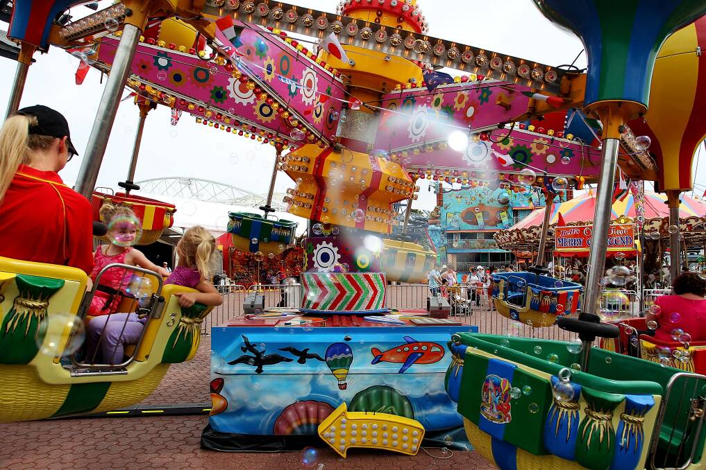 Sydneysiders take to the rides at 'Side Show Alley' during the Sydney Royal Easter Show in Sydney, Australia. Photo by Lisa Maree Williams/Getty Images