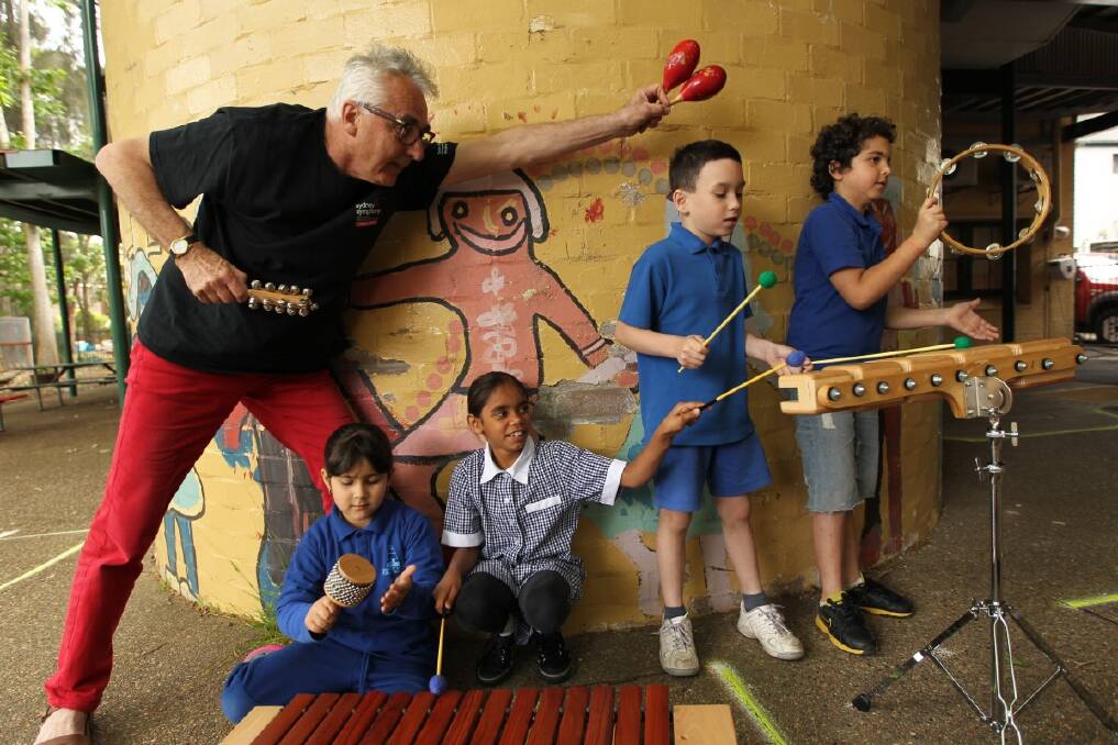 Music for Schools launch. L-R Rick Miller (the principal timpanist with Sydney Symphony Orchestra) with Plunkett Street Public School students Rose, Kia, Shannon and Kareem. Photo: Tamara Dean
