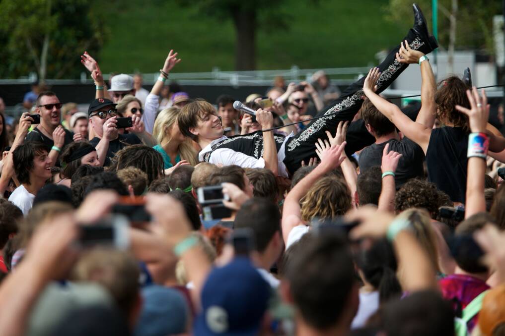 Howlin' Pelle Almqvist from The Hives goes crowd surfing. Photo by Jason South.