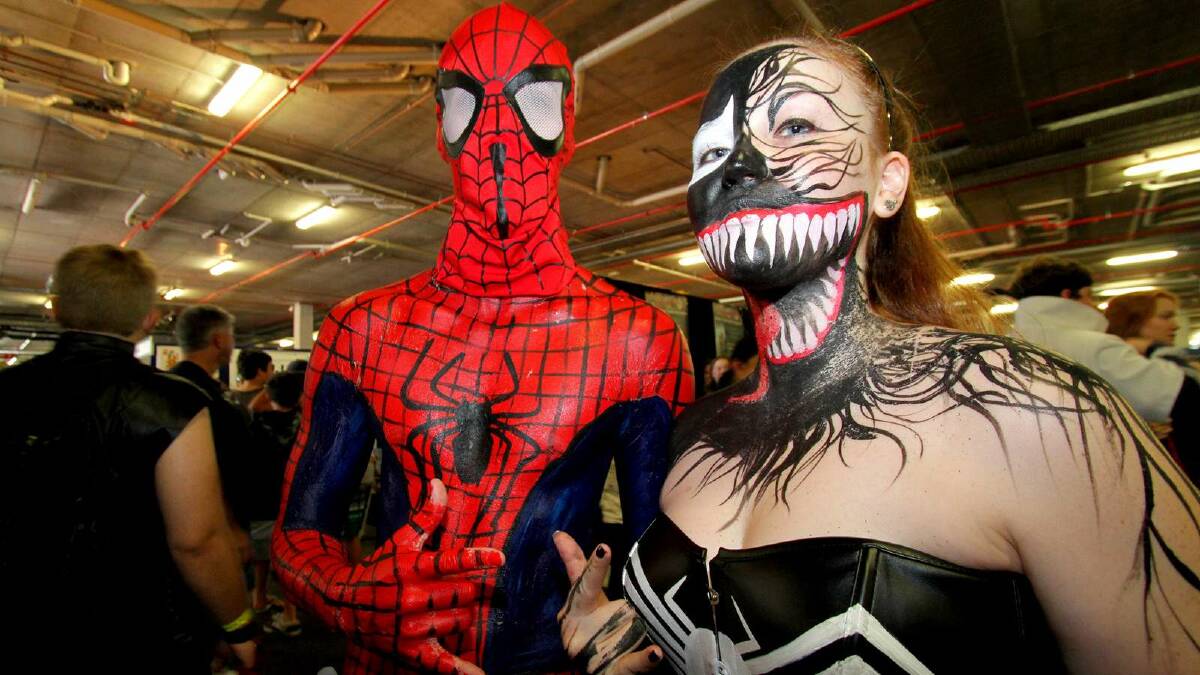 Sam Caughley as Spiderman and Corrine Gilday as Venom at the Supanova Pop Culture Expo in Brisbane. Picture: Michelle Smith
