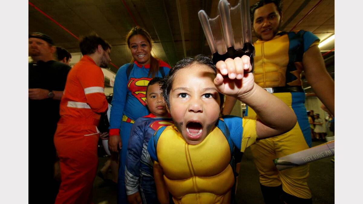 The Robertson family - mum Lah, dad Chad, Shaelyn, 5, and Mordecai, 4 - dress up as Wolverine and Superman at the Supanova Pop Culture Expo in Brisbane. Picture: Michelle Smith