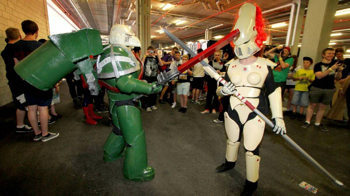 David and Amyelle Pilgrim dressed up as space marine and howling banshee from Warhammer 40K at the Supanova Pop Culture Expo in Brisbane. Picture: Michelle Smith