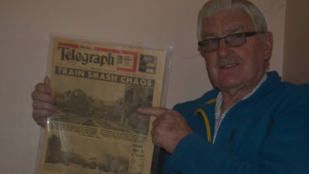 Peter Sheridan with a 1963 edition of the Sydney Telegraph featuring photographs of the Geurie rail disaster. The newspaper is part of a museum display at the old Wellington police station. 		           Photo: Farren Hotham