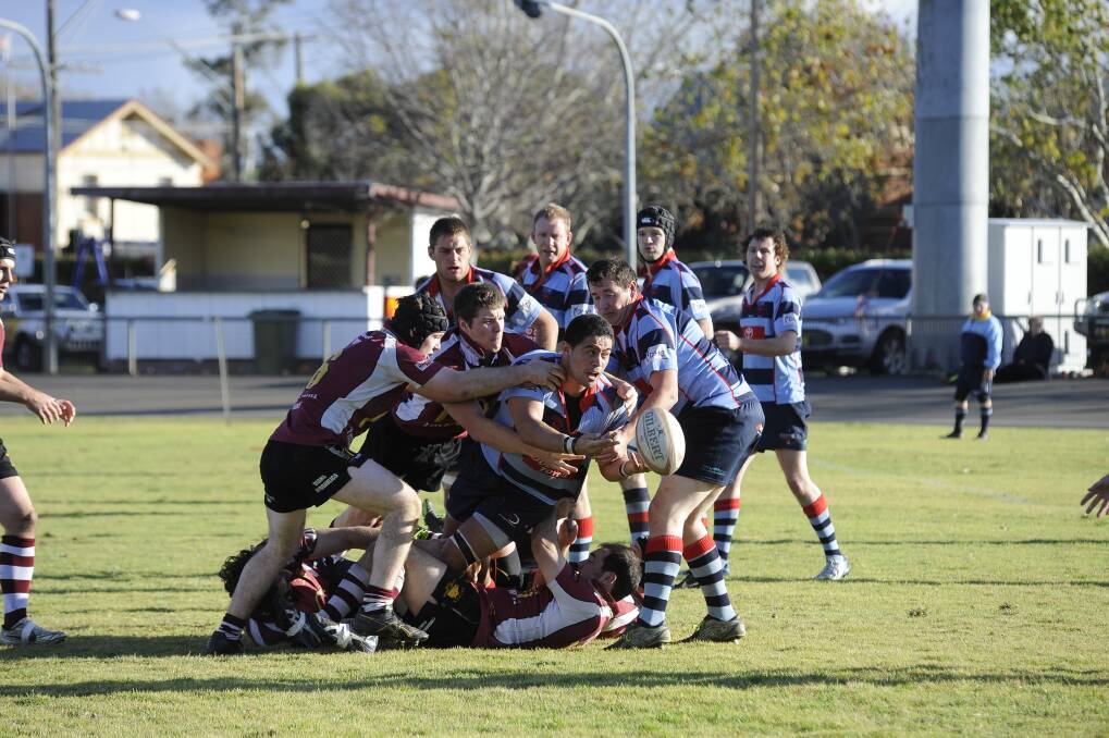 Dubbo Kangaroos captain Peter Nau attracts the attention of the Parkes defence on Saturday. Photo: CHERYL BURKE