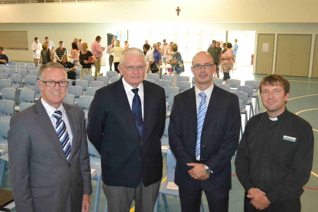 Macquarie Anglican Grammar School principal Geoffrey Fouracre, school council chairman Ron Hacker, deputy principal Louis Stringer and Reverend Nicholas Hurford prepare to talk to parents about the sale of the school as a going concern at a recent meeting.	Photo: SIMON CHAMBERLAIN