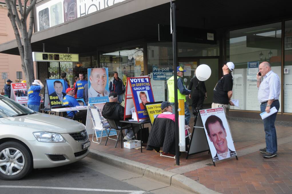 Candidates for Dubbo City Council outside the Dubbo returning office as voters go to pre-poll. Photo: BELINDA SOOLE