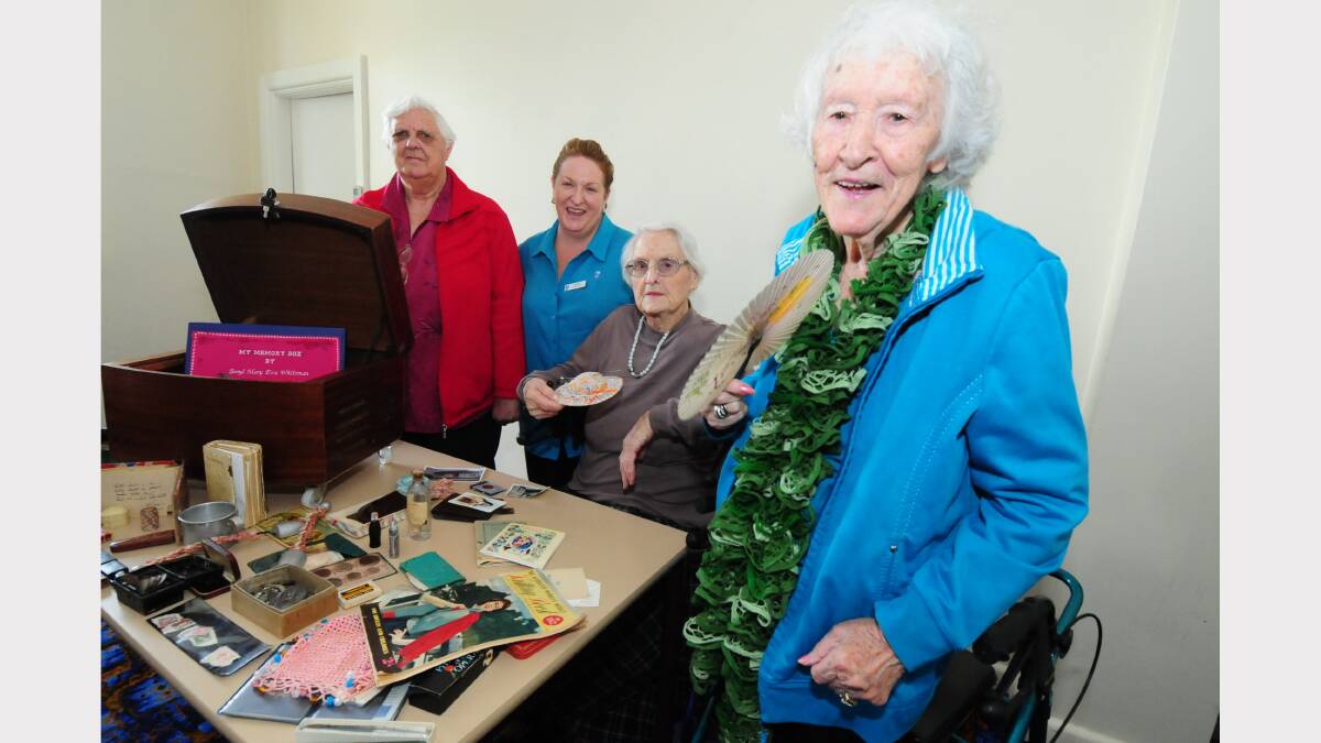 Yeoval resdients, Janice Conroy, Joan Wykes and May Murray with Yeoval Aged Care recreation activities officer Kerry Whiteman reminisce ahead of Glory Box Days. Photo: LOUISE DONGES