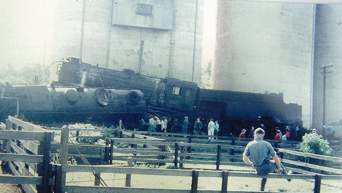 Spectators gather around the wreckage of the Geurie rail crash in August 1963. Photo: Peter Sheridan