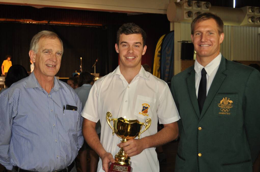 Gerard Yeo Memorial Trophy winner James English (centre) with Pat Yeo and special guest Sam McGregor at the St John's Catholic College sports awards assembly.