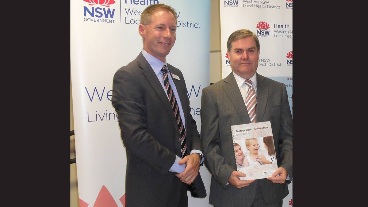 Western NSW Local Health District (LHD) chief executive Scott McLachlan and chairman of the LHD board Robin Williams take part in the launch at Molong of its Strategic Health Services Plan. Photo contributed