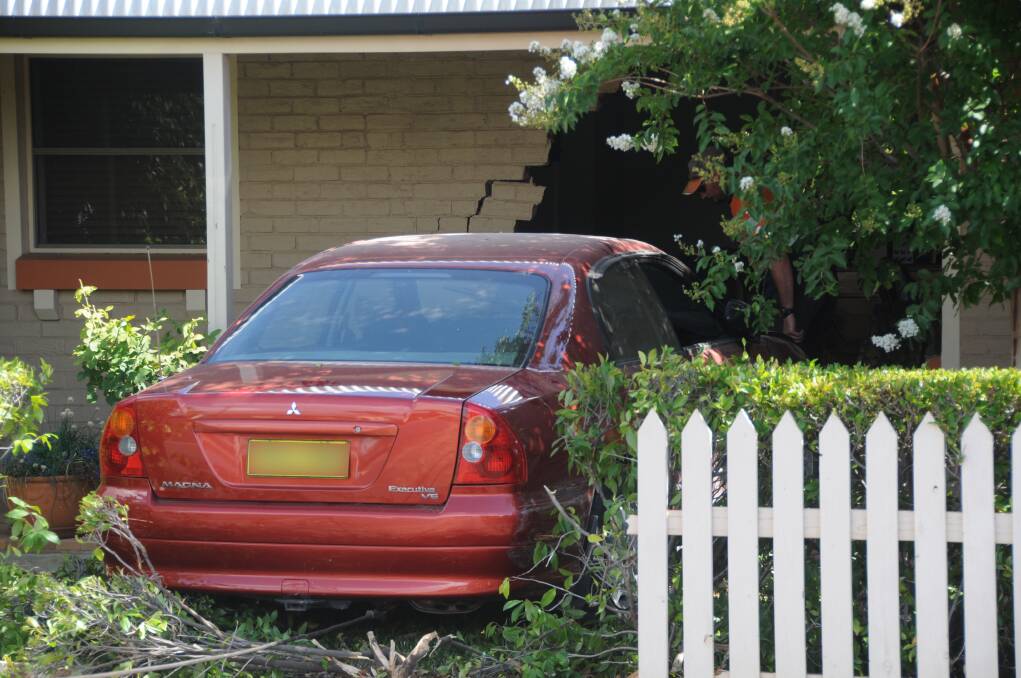 Car crashes into elderly couple's home, passenger taken to hospital with minor injuries. Photo: AMY McINTYRE